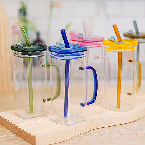 Glass cup with straw